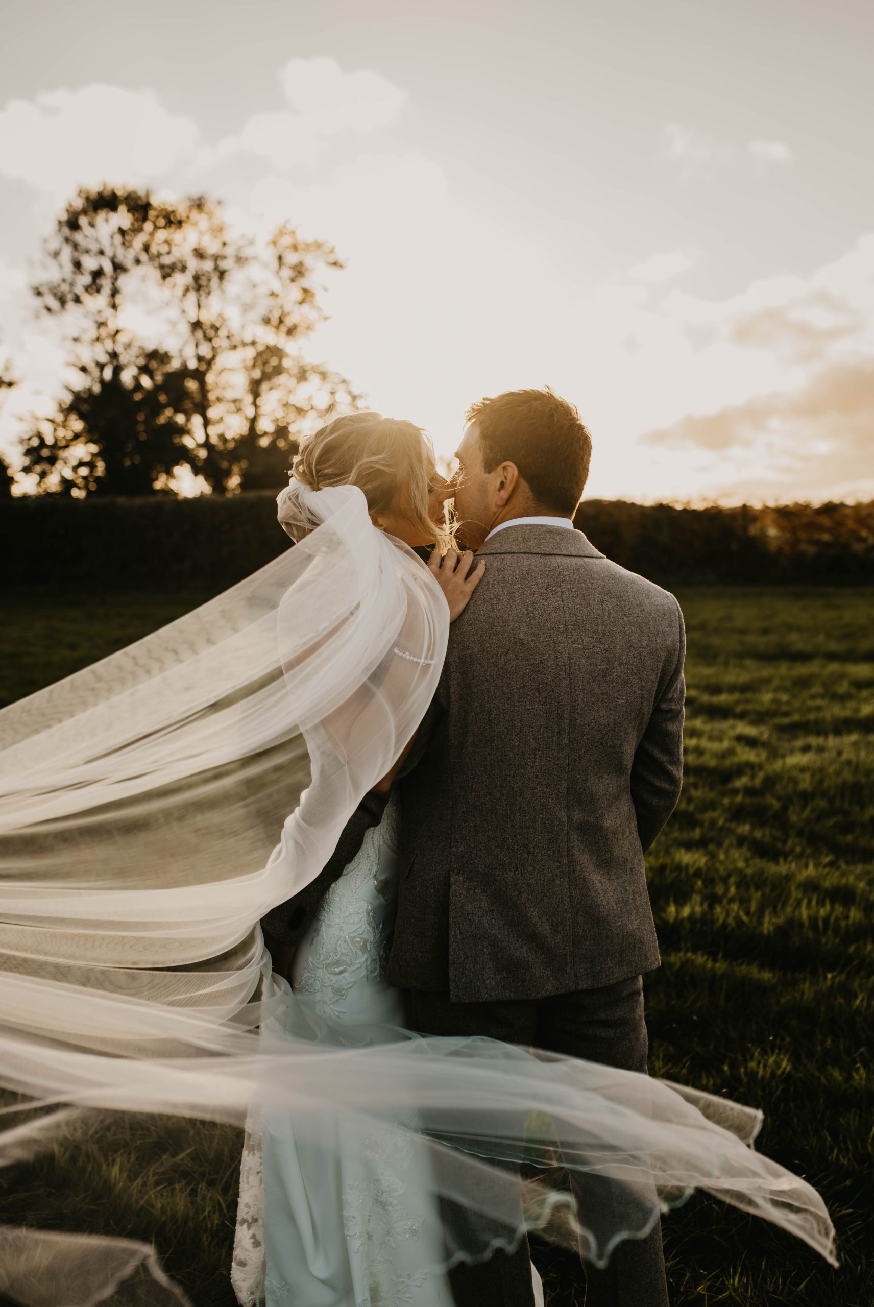 Bride and Groom watching the sunset on their wedding day